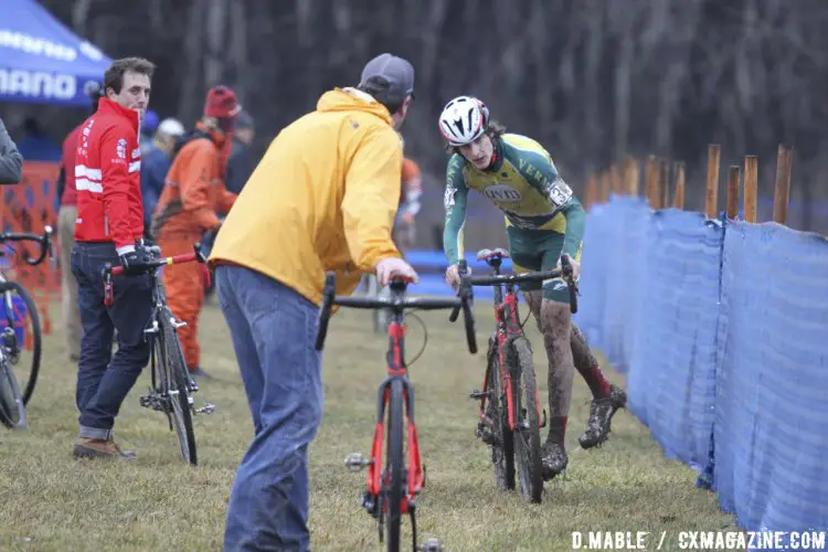 University of Vermont rider Matthew Owens rolls into the pit to change bikes on the muddy course in Hartford, Conneticut. 2017 Cyclocross National Championships. ©D. Mable/Cyclocross Magazine