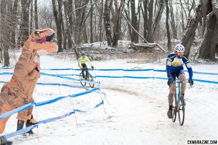 Nothing like a dinosaur cheering you on to keep you inspired. 2017 Cyclocross National Championships, Masters Men 35-39. © A. Yee / Cyclocross Magazine