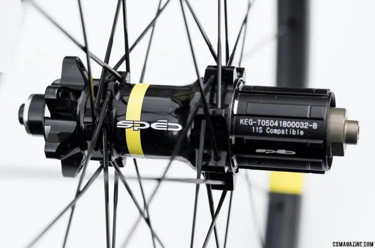 Sped Precision designs its own hubs, and they're glossy handsome units with a touch of a Mavic color scheme. © C. Lee / Cyclocross Magazine