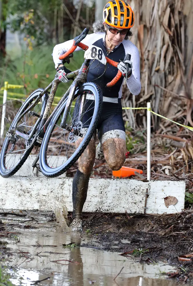 Linda Elgart is a mainstay at the series, and shows off her form on the second set of barriers. Rockville Bike Cyclocross Series, Solano Community College. © John Silva