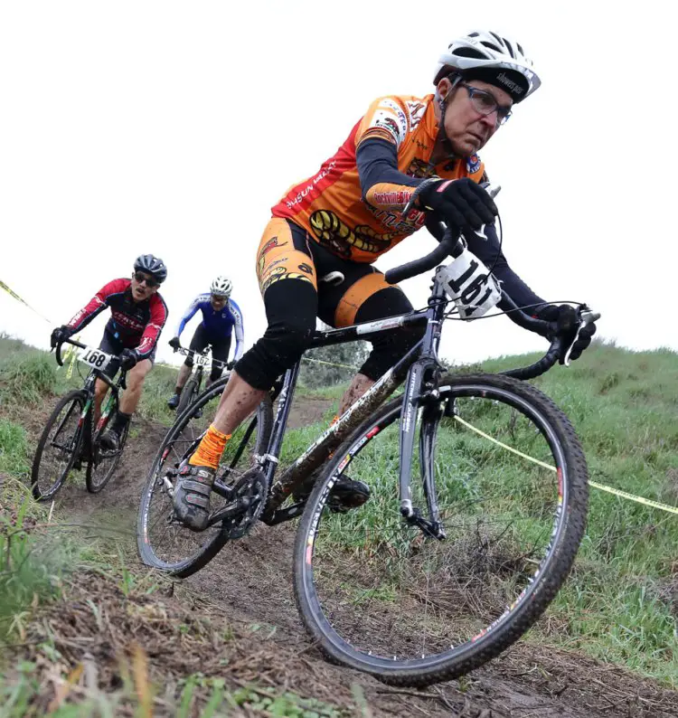 Dropping off the hill, Bill DeWolfe finds the sweet line ahead of Clifford Lee and Steve Tamanaha. Rockville Bike Cyclocross Series, Solano Community College. © John Silva