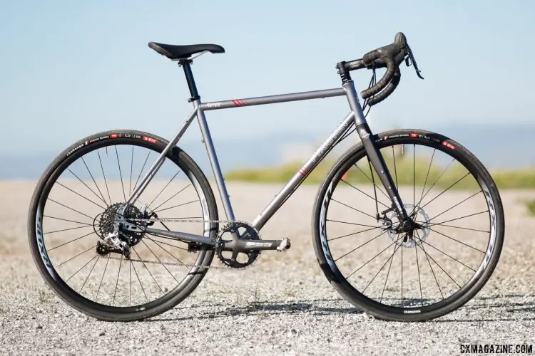 Fyxation Quiver Disc with Sparta carbon fork rides like a traditional old-school road bike, with a low bottom bracket, steel frame and narrow bars. The carbon fork and a tire swap (Challenge Strada Bianca pictured) improves ride comfort . © Cyclocross Magazine