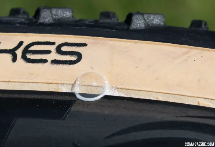 The bead is not the stiffest or tightest, and can develop a few wrinkles from being shipped folded. These wrinkles take a little time to seal up but eventually seal with sealant. Islabikes Gréim Pro tubeless cyclocross tire. © Cyclocross Magazine