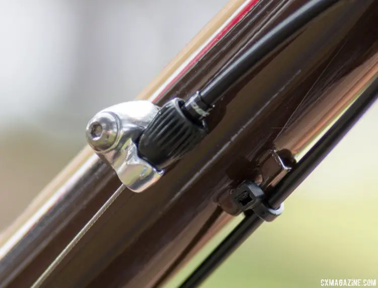 It's been a while since we've seen down tube inline cable stops and barrel adjusters, but they're welcomed and allow for easy cable tension adjustment or easy use of your old 7800 STI levers with external cable housing. 2017 Raleigh Stuntman. © Cyclocross Magazine