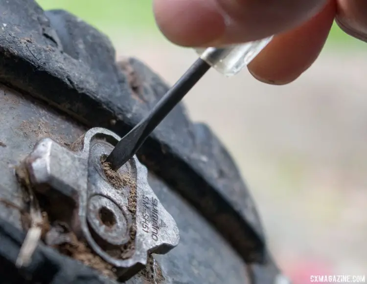 An eyeglass screwdriver makes a great tool for cleaning the cleat bolt's hex socket. Tips to remove stuck cleat bolts of SPD or other mountain bike pedals. © Cyclocross Magazine