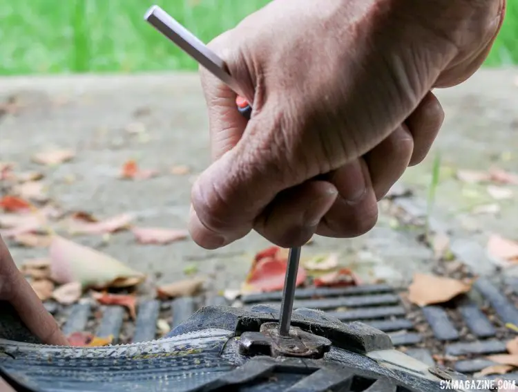 A Y-wrench or multi-tool is often preferable to a single hex wrench just because you can apply more downward pressure when trying to loosen the bolt and avoid stripping the hex hole. Tips to remove stuck cleat bolts of SPD or other mountain bike pedals. © Cyclocross Magazine