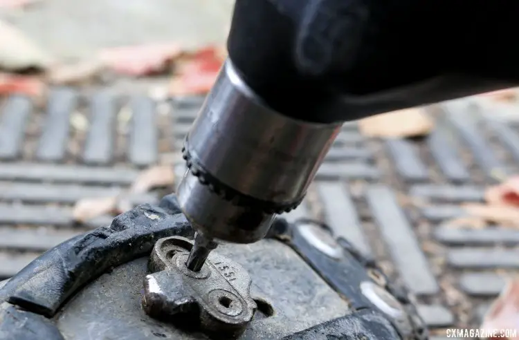 If a handheld Torx wrench doesn't work, sometimes a power drill will help provide extra torque and pressure to get the bolt loosened. Tips to remove stuck cleat bolts of SPD or other mountain bike pedals. © Cyclocross Magazine