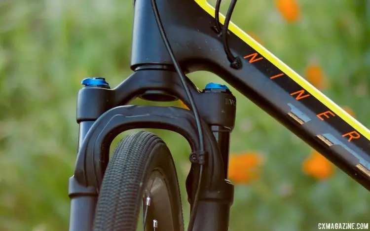 Clearance is tight but a thicker crown race keeps the knobs from hitting the down tube on our carbon Niner RLT. The 32 Step-Cast AX (Adventure Cross) suspension fork for gravel bikes. © Cyclocross Magazine