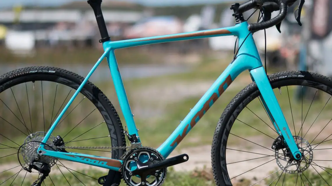 The new 2018 carbon Kona Major Jake cyclocross bike has gotten a bit lower, with BB drops from 68-72mm, and features generous head tube lengths. Pictured is a 56, which is closer to a 58 in most brands. Head angles are also said to be a bit slacker than previous models. 2017 Sea Otter Classic. © A. Yee / Cyclocross Magazine