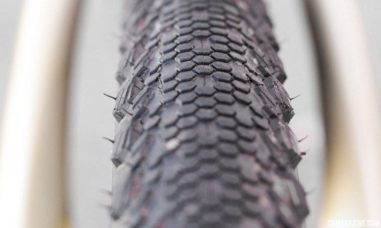 Vittoria's new 40c Terreno TNT Tubeless tires features a fish scale-like Dry conditions tire that has a smoother leading edge and a trailing edge that bites in during braking. The tread features three different knob heights, increasing in height as you move to the shoulders. 2017 Sea Otter Classic. © Cyclocross Magazine