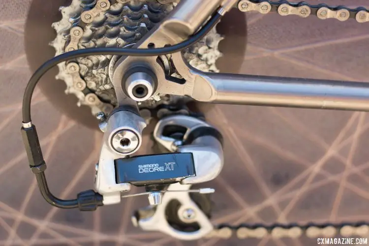 A short cage M735 Deore XT rear derailleur handles rear shifting, as XTR was a few months away. Note the noodle used to shorten the housing loop. Eric Rumpf's John Tomac replica 1991 Raleigh Signature ti/carbon drop bar mountain bike. © Cyclocross Magazine