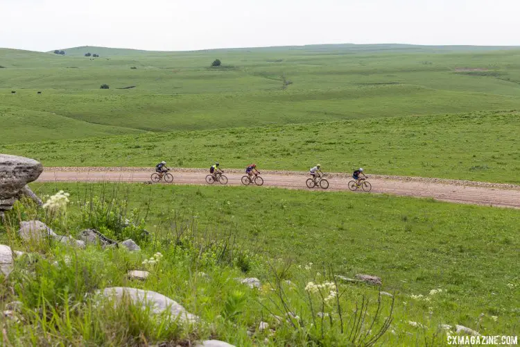 Small packs form, and riders quickly become family in the fight to find the finish. 2017 Dirty Kanza gravel race. © Christopher Nichols