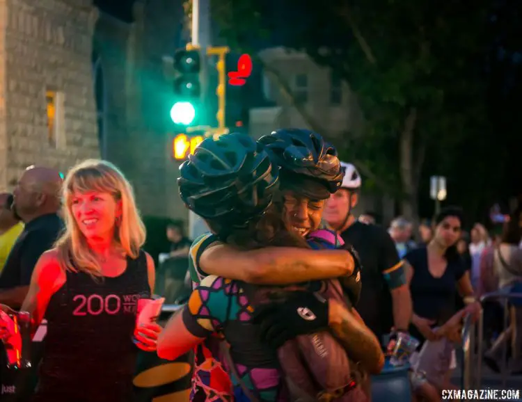 Finishers enjoy a moment of intense pride, regardless of finish time and position. 2017 Dirty Kanza gravel race. © Christopher Nichols