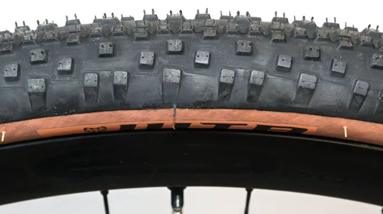 The side knobs are buttressed and tapered to avoid squirm when cornering on the road. WTB Resolute 42 gravel tire. © Cyclocross Magazine