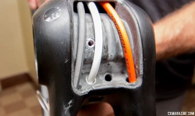 The 2018 Kona carbon cyclocross bikes feature easy access to the internal routed housing. There's even an extra spot for a dropper post cable. © Cyclocross Magazine