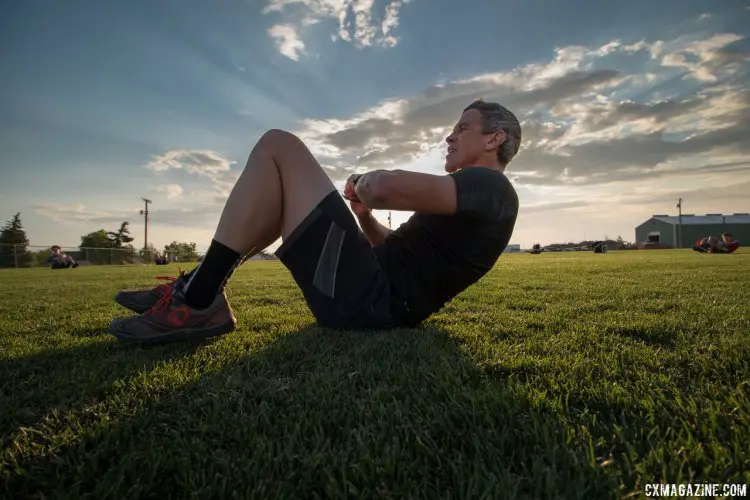 Geoff Proctor leads the group through crunches in a time-crunched training camp. 2017 Montana Cross Camp © Cyclocross Magazine