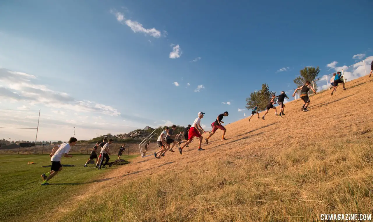 The morning workout has a lot of running, including a cross country warm-up, stadium stairs, and hill repeats as seen here. 2017 Montana Cross Camp © Cyclocross Magazine