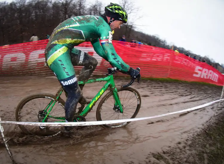 Jonathan Page (Fuji) making his way through the water that accumulated near the pits due to bike washing.