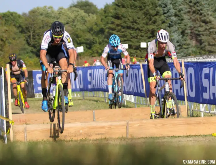 Even with only a few laps to go, the race for the podium was anyone's guess. Here Gianni Vermeersch and Vincent Baestaens lead over the barriers. © D. Mable / cxmagazine.com