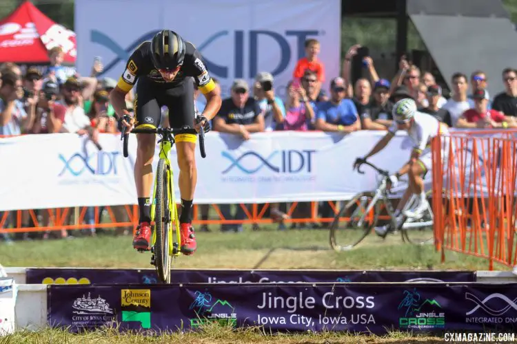 Quinten Hermans hops the barriers early in the race, as Wout Van Aert rounds the corner behind him. 2017 Jingle Cross World Cup. © David Mable / Cyclocross Magazine.