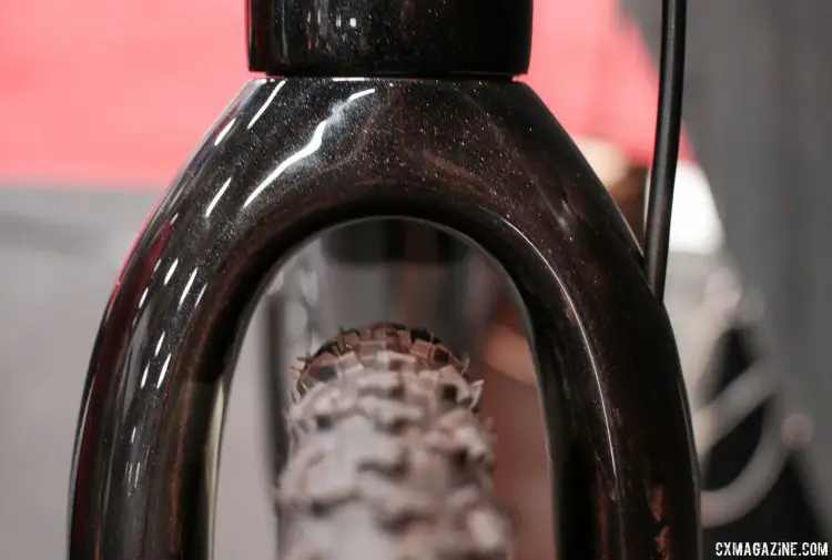 The updated 2018 Van Dessel Full Tilt Boogie carbon cyclocross bike's fork has been redesigned down below for Mavic's SpeedRelease thru axle, but still offers massive clearance for 29er mtb tires up front. Interbike 2017 © Cyclocross Magazine