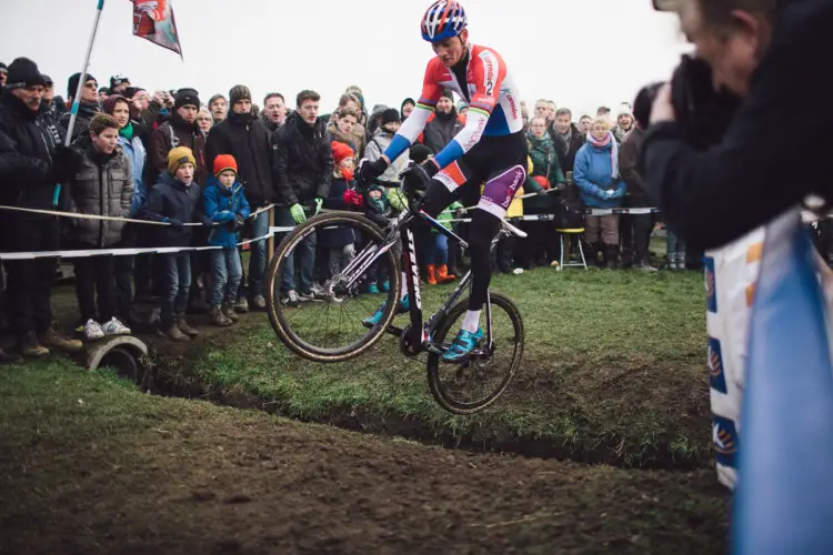 Mathieu van der Poel hops one of the small drainage ditches. Cyclocross DVV Verzekeringen Trofee #6 - Azencross, Loenhout © B. Hamvas / cyclephotos.co.uk