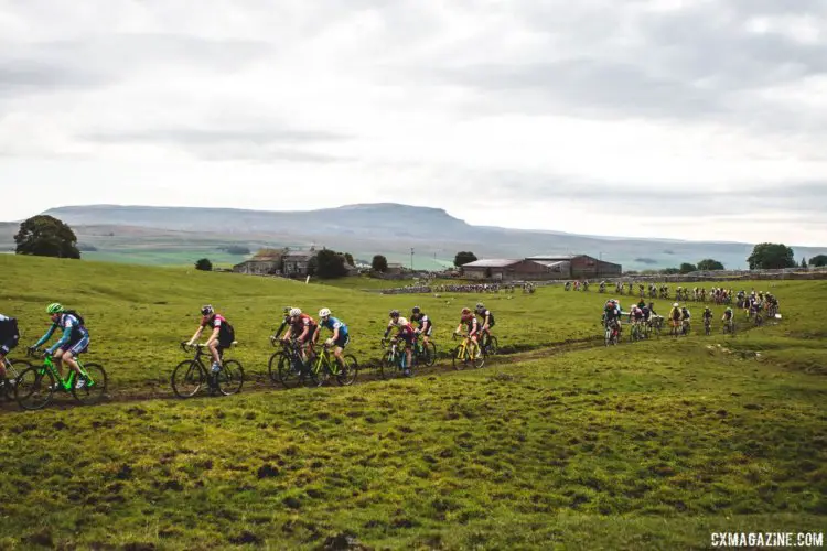 Part of the Three Peaks race uses private farmland. The Pen-y-ghent peak, the last of the three climbs, looms in the background. 2017 Three Peaks Cyclocross. © D. Monaghan / Cyclocross Magazine