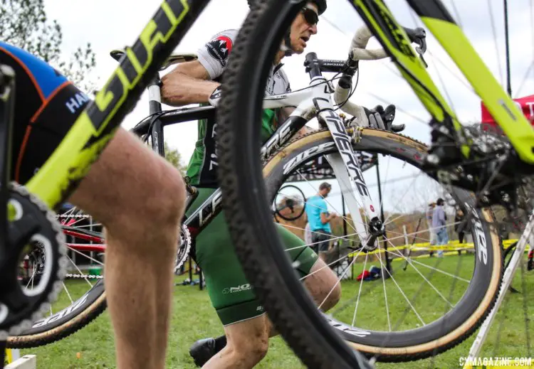 A peek at a Neff Cycle Service rider through a wheel. 2017 Grafton Pumpkin Cross. © Z. Schuster / Cyclocross Magazine