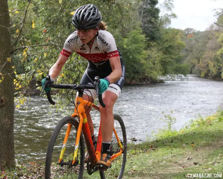 Emily Nordahl riders along the river. 2017 Grafton Pumpkin Cross. © Z. Schuster / Cyclocross Magazine