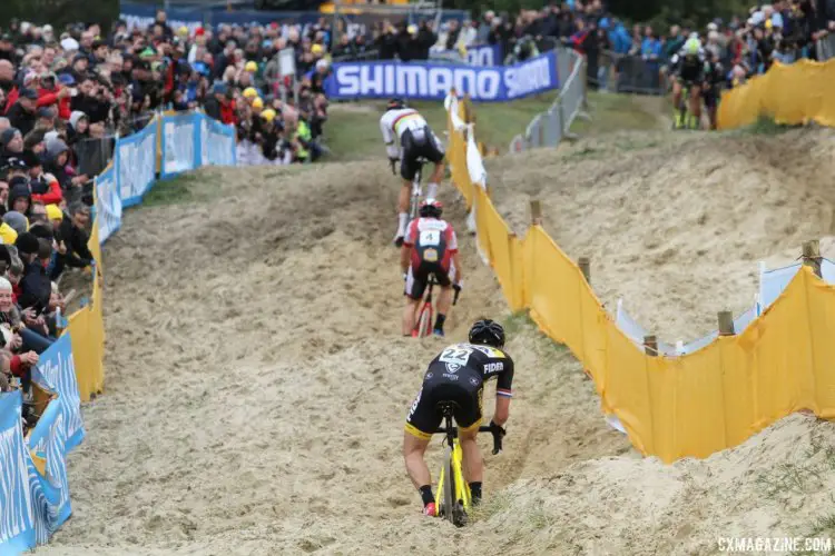 Wout van Aert, Lars van der Haar and Laurens Sweeck work to stay upright in the sane. 2017 World Cup Koksijde. © B. Hazen / Cyclocross