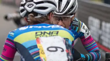 Pivot Cycles p/b DNA Cycling teammates Courtenay McFadden and Sofia Gomez Villafane share a muddy moment. Elite Women, 2017 Cincinnati Cyclocross, Day 2, Harbin Park. © Cyclocross Magazine