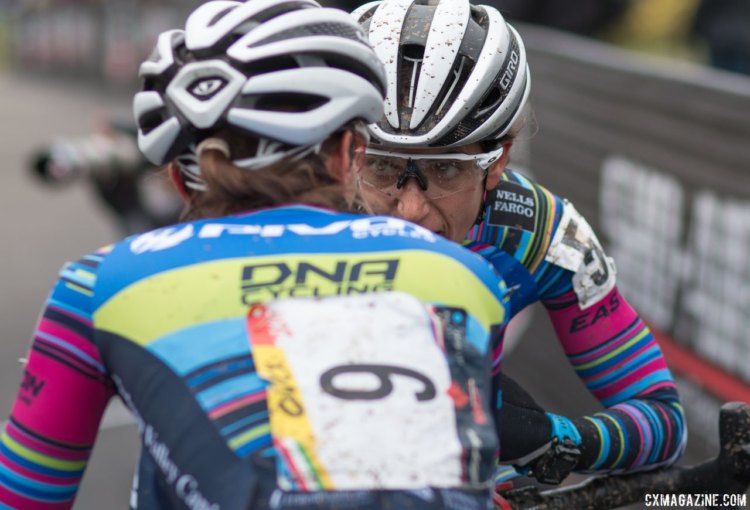 Pivot Cycles p/b DNA Cycling teammates Courtenay McFadden and Sofia Gomez Villafane share a muddy moment. Elite Women, 2017 Cincinnati Cyclocross, Day 2, Harbin Park. © Cyclocross Magazine