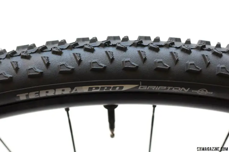 The Terra takes an interesting approach to its knobs and grip, featuring taller edges but a scooped-out center for more edges to grip and a bit of weight savings. © Cyclocross Magazine