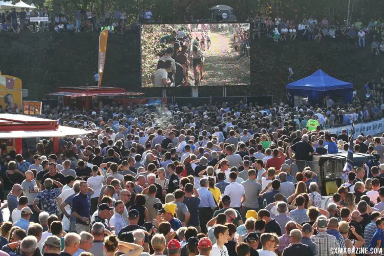 Fans watch the racing on the jumbotron. 2017 Superprestige Zonhoven. © B. Hazen / Cyclocross Magazine