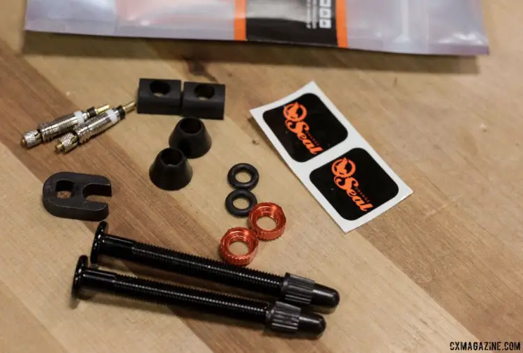 Orange Seal's RVC tubeless valves come with extra valve cores, and two different shapes of grommets. Prices differ based on length but hover around $24 per pair. Tubeless tire valve comparison and review. © Cyclocross Magazine