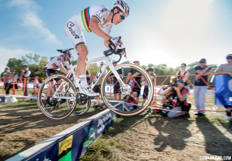 Stripes in flight: Wout van Aert leads Stephen Hyde over the barriers. 2017 Jingle Cross World Cup. © A. Yee / Cyclocross Magazine