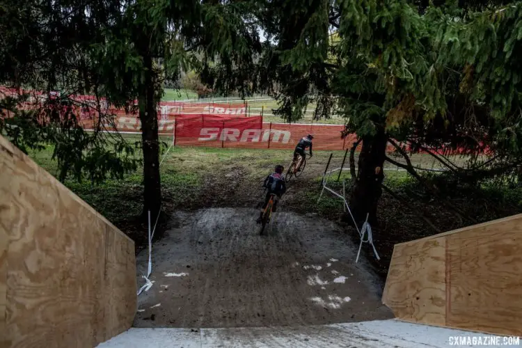 The exit from the flyover is steep and goes right to a sharp right-hand turn before the pit. 2017 Derby City Cup, © D. Perker / Cyclocross Magazine