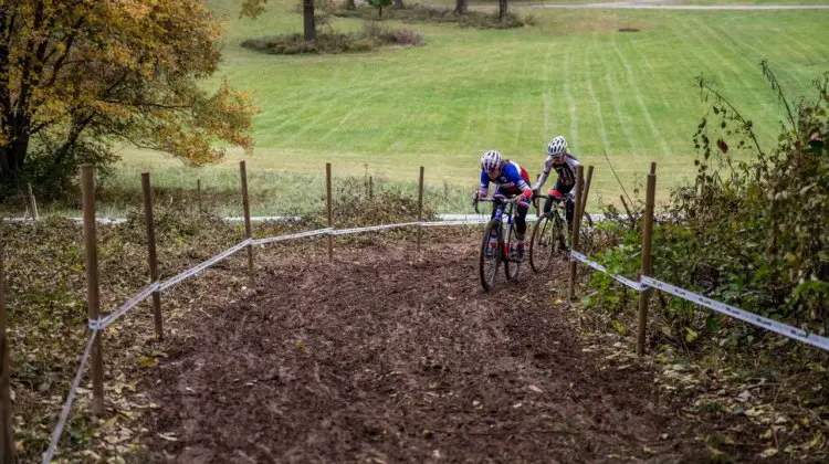 Caroline Mani and Christel Ferrier-Bruneau grind their way up the first of three muddy climbs. 2017 Derby City Cup. © D. Perker / Cyclocross Magazine