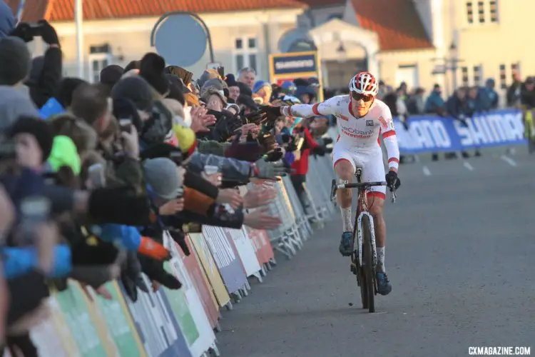 Mathieu van der Poel high fives some fans down the stretch en route to the finish line. 2017 Bogense UCI Cyclocross World Cup. © B. Hazen / Cyclocross Magazine