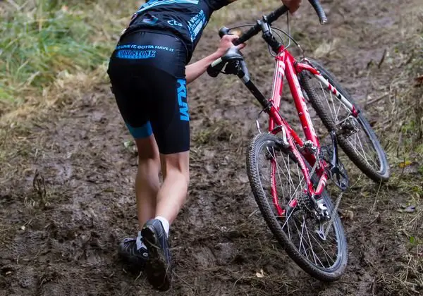 A young rider tackles a muddy run-up. photo: Bob Bruce