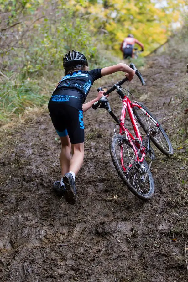 A young rider tackles a muddy run-up. photo: Bob Bruce