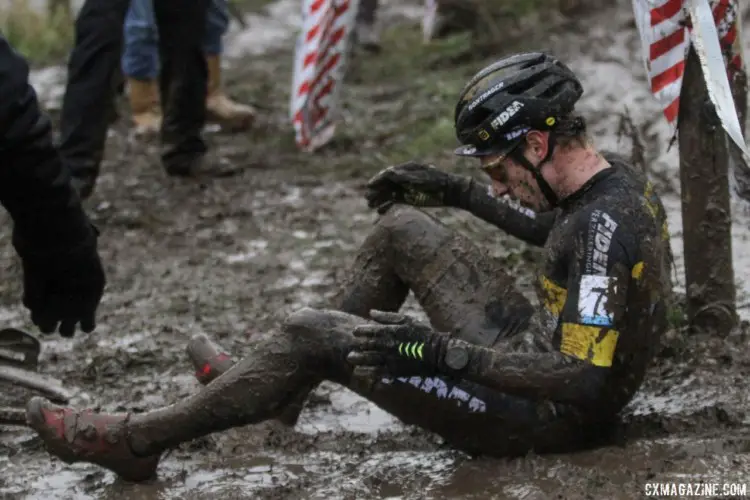 Quinten Hermans had to shake off a spill that sent him under the course tape. 2017 Vlaamse Druivencross. © B. Hazen / Cyclocross Magazine