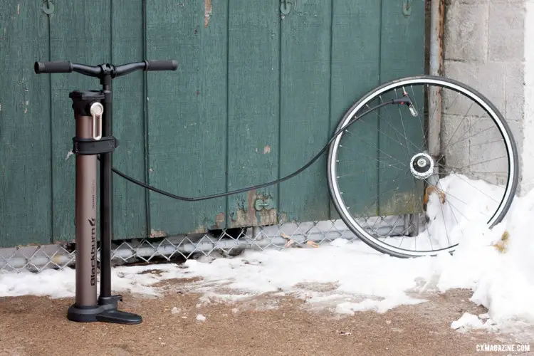 The Blackburn Chamber Tubeless Floor Pump's 4-foot-long hose keeps keeps your wheel far away as you attempt to seat your tubeless tire. It also can reach a bike on a car rack or in a repair stand. © Cyclocross Magazine