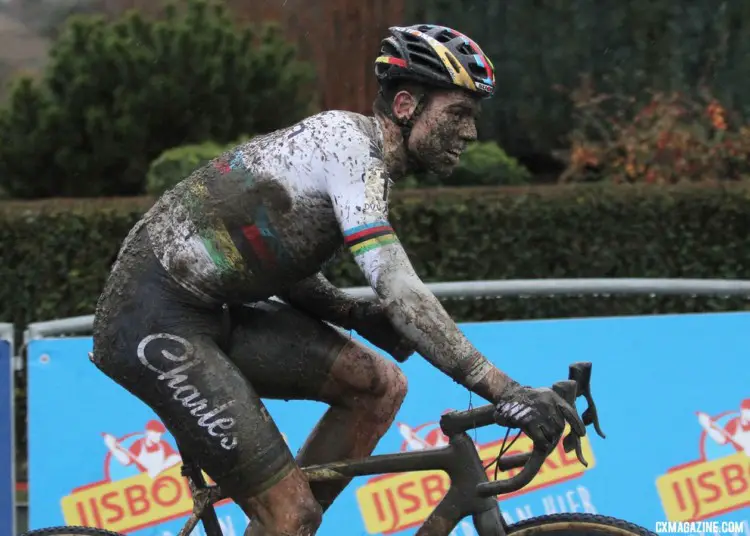 Wout van Aert gingerly hangs his left arm after crashing at the barriers on the last lap. 2018 GP Sven Nys Baal - Elite Men. © B. Hazen / Cyclocross Magazine