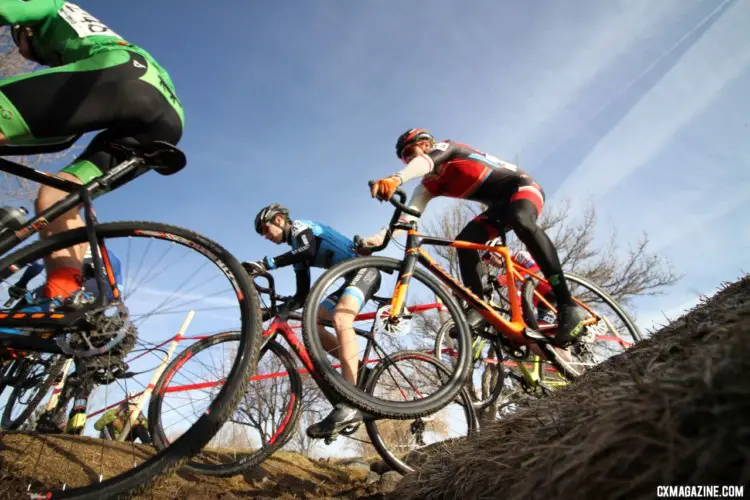 Junior Men soar over the ditch. 2018 Cyclocross National Championships. © D. Mable/ Cyclocross Magazine