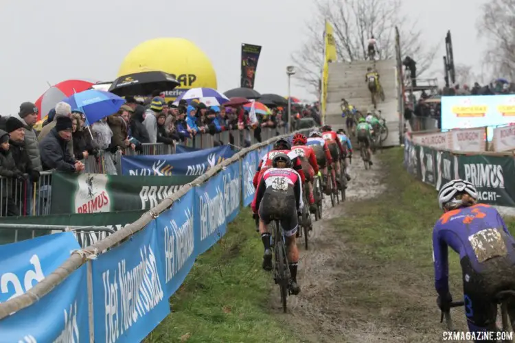 The train of riders heads toward the flyover. 2018 GP Sven Nys Baal. © B. Hazen / Cyclocross Magazine