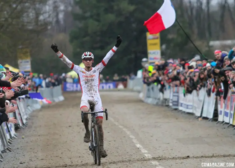 Mathieu van der Poel celebrates his win as the French flag waves in the background. 2018 Telenet UCI World Cup Nommay. © B. Hazen / Cyclocross Magazine