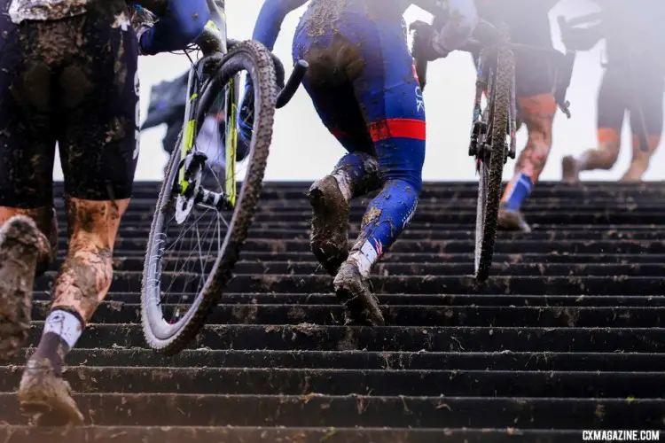 Riders head up the stairs. The course featured frequent dismounts. Junior Men, 2018 UCI Cyclocross World Championships, Valkenburg-Limburg, The Netherlands. © Gavin Gould / Cyclocross Magazine