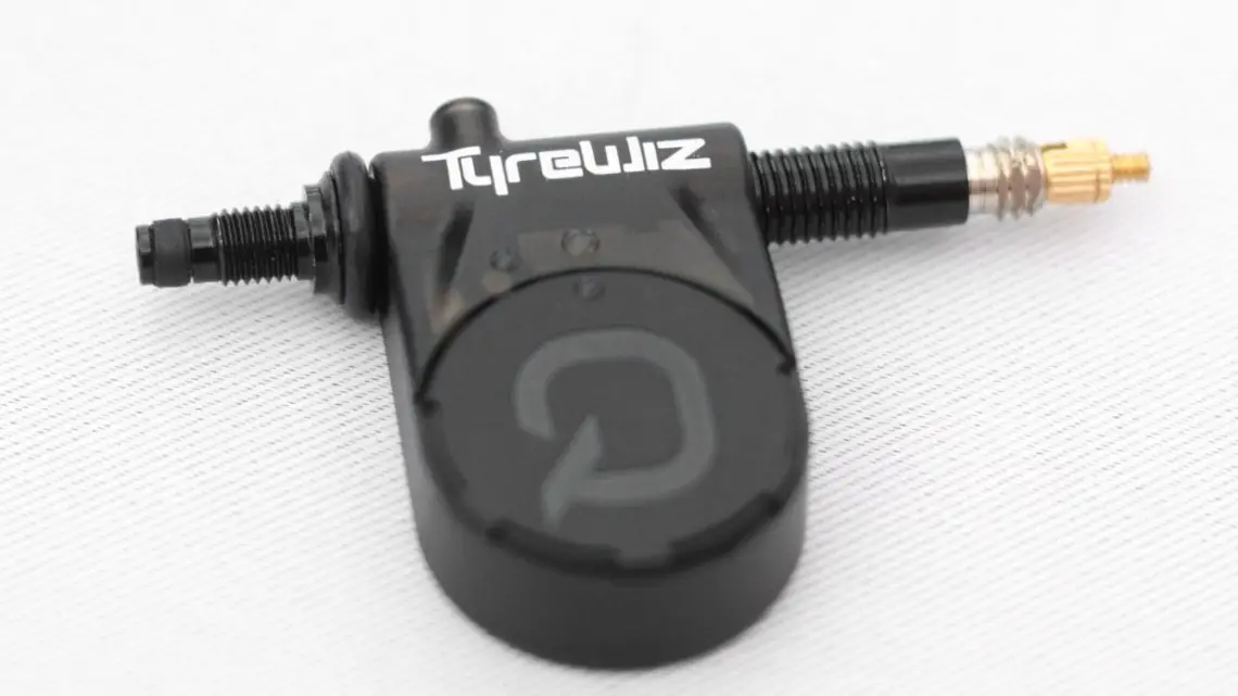 The new Quarq TyreWiz provides real-time tire pressure readings. Quarq TyreWiz Tire Pressure Sensor. 2018 Sea Otter Classic. © Cyclocross Magazine