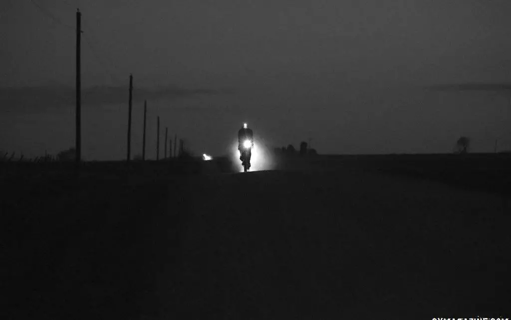 A rider blazes his way through the night along Iowa's gravel roads. 2018 Trans Iowa Gravel Race. © Jon Duke / Cyclocross Magazine
